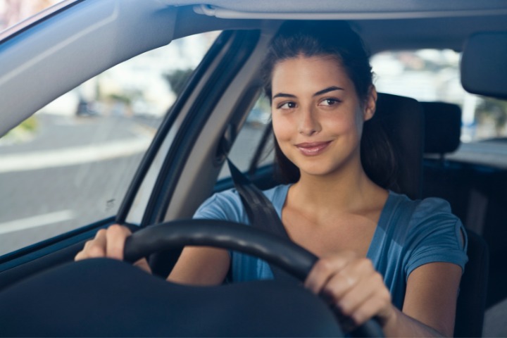 women driving in car