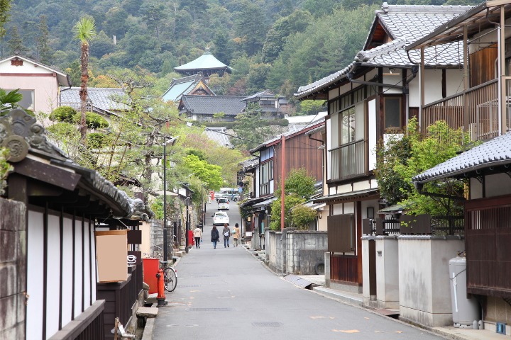 a photo of an old Japanese street called Miyajima Machiya Street