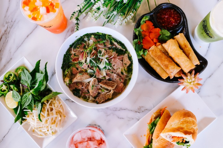 a spread of vietnamese food at a vietnamese restaurant