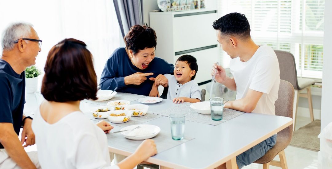 photo of smiling family in front of house japan