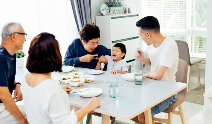 photo of smiling family in front of house japan