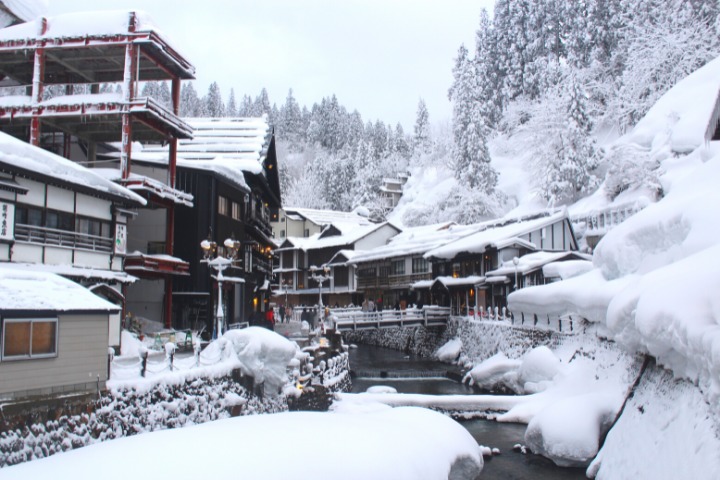 a photo of ginzan onsen in yamagata japan covered in snow