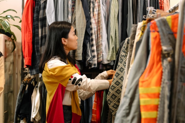 photo of a woman thrifting in a secondhand clothes store