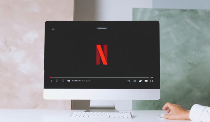 a photo of a computer showing the netflix logo