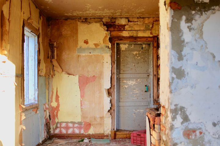 a photo of the interior of an abandoned house 