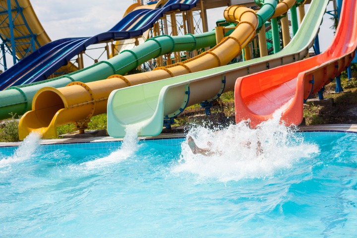 Water flows from sliders in a water park