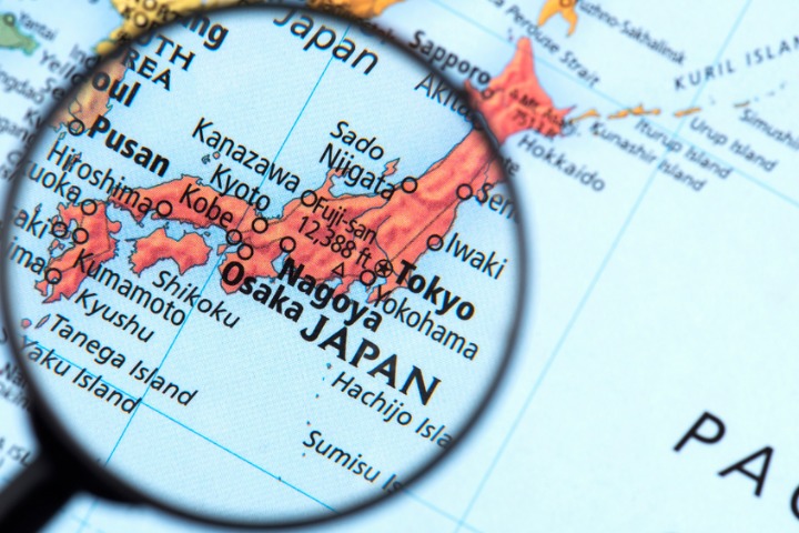a photo of a map of japan with a magnifying glass over it
