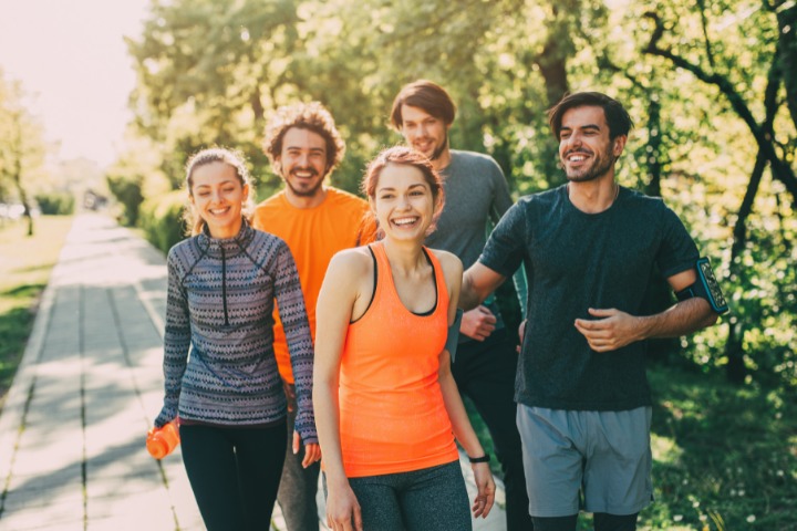 a photo of five people having a sports meetup to go running