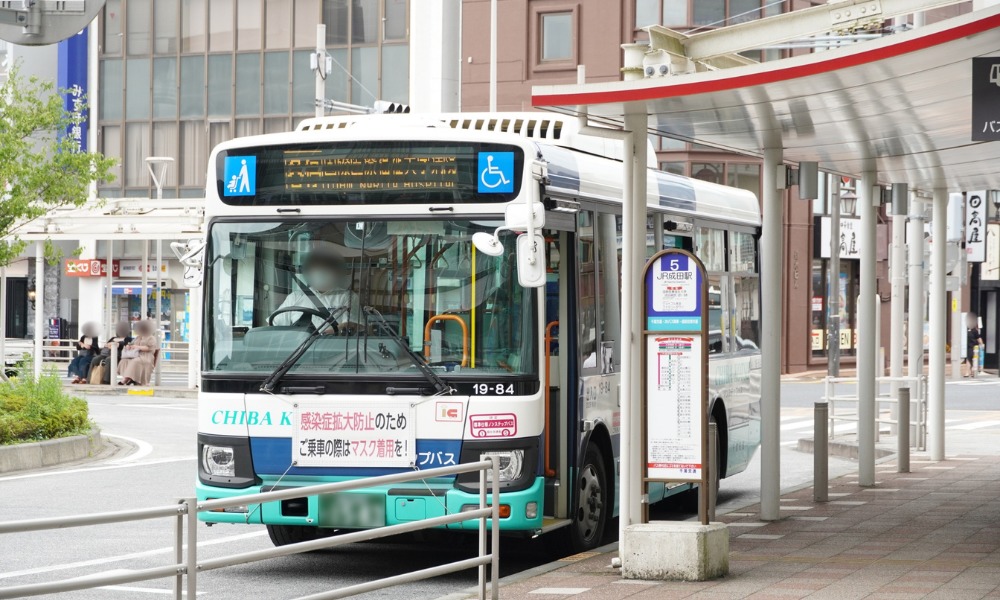 an image of a bus in japan at the bus stop