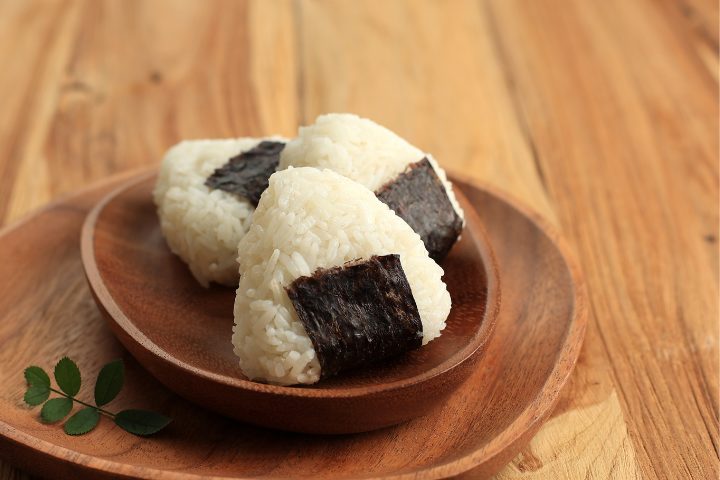 three onigiri on a plate