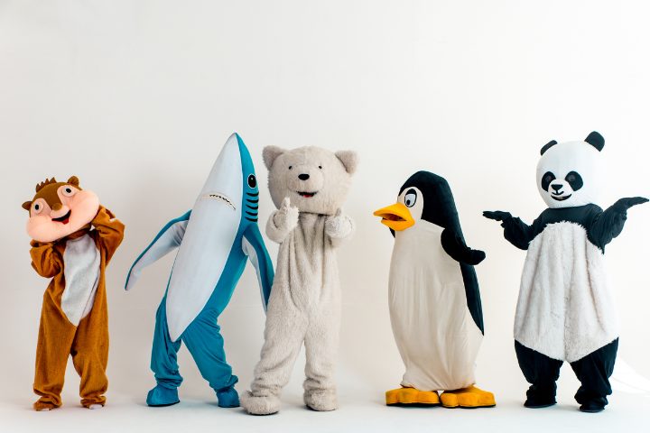 Five kawaii, colorful mascots standing together