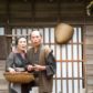 a photo of an old japanese couple dressed in edo period clothing